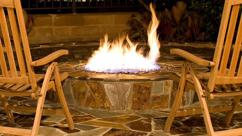PHOTO: A fire pit burns in a backyard setting in an undated stock image.