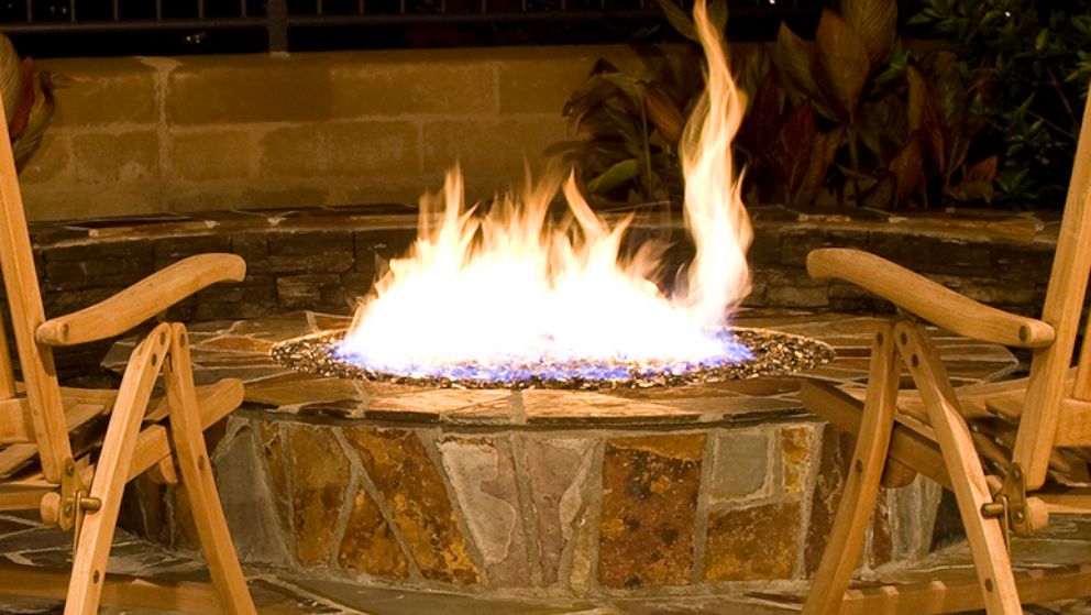 PHOTO: A fire pit burns in a backyard setting in an undated stock image.