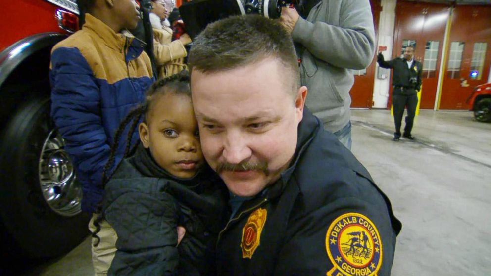 PHOTO: Destiny Nelson, 5, reunites with Captain Scott Stroup of the Dekalb County Fire Rescue Department, the man who caught her when she was thrown to safety from the balcony of a burning apartment building.