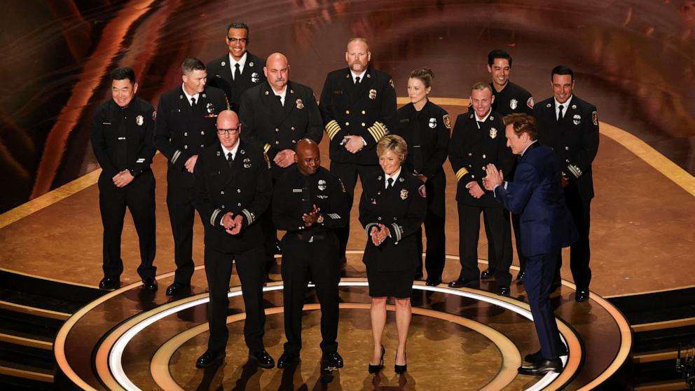 PHOTO: Host Conan O'Brien applauds during a tribute to the firefighters who battled Los Angeles wildfires, at the Oscars show at the 97th Academy Awards in Hollywood, March 2, 2025. 