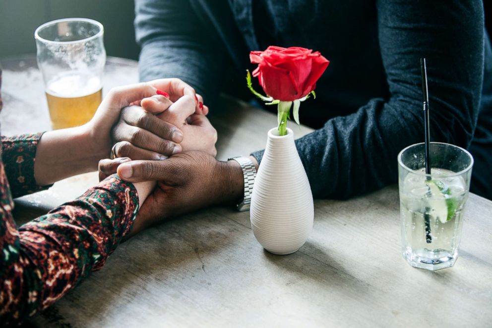 PHOTO: A couple hold hands while on a date in this stock photo.