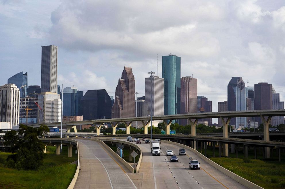 PHOTO: Traffic moves past the skyline of Houston, Texas, June 27, 2020. 