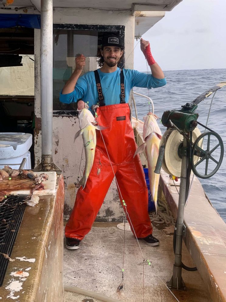 PHOTO: A fisherman for Abundant Seafood in South Carolina holds up his fresh catch.