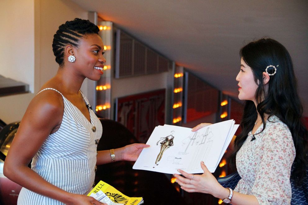 PHOTO: FIT student Ruby SeoHee Shin shows actress Adrienne Walker, who plays Nala in the Broadway production of "The Lion King," sketches for Nala-inspired garments.