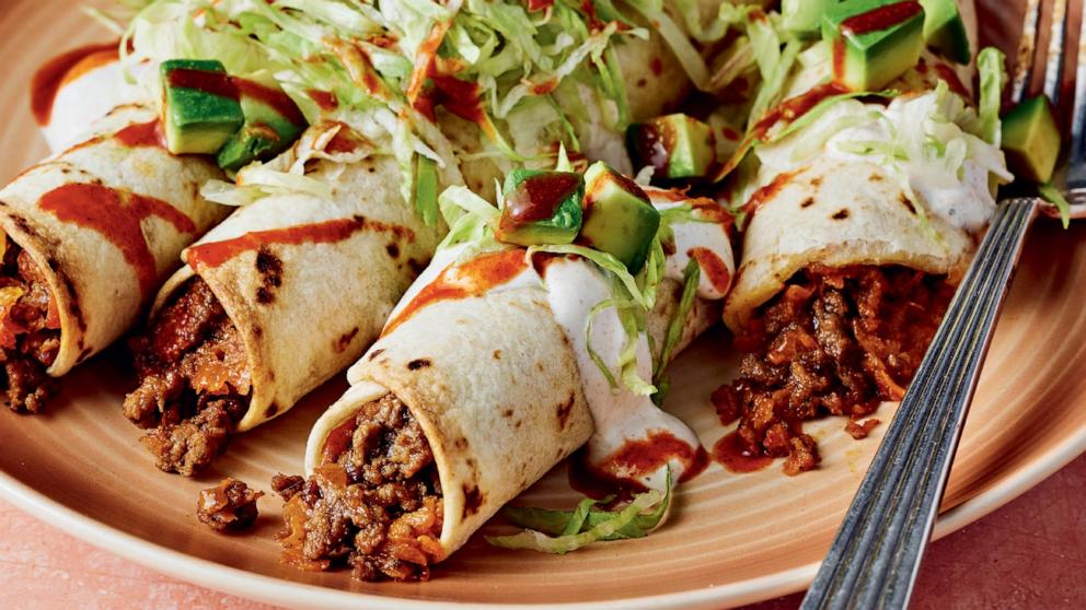 PHOTO: A plate of cheesy beef and sweet potato flautas.