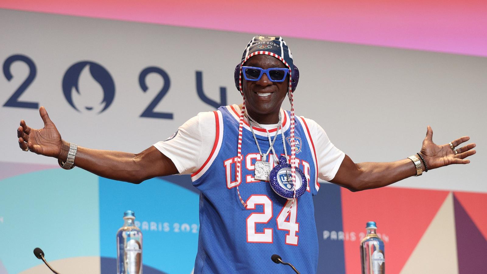 PHOTO: Flavor Flav speaks during a Team USA Water Polo press conference at the Main Press Centre, on July 26, 2024, in Paris.