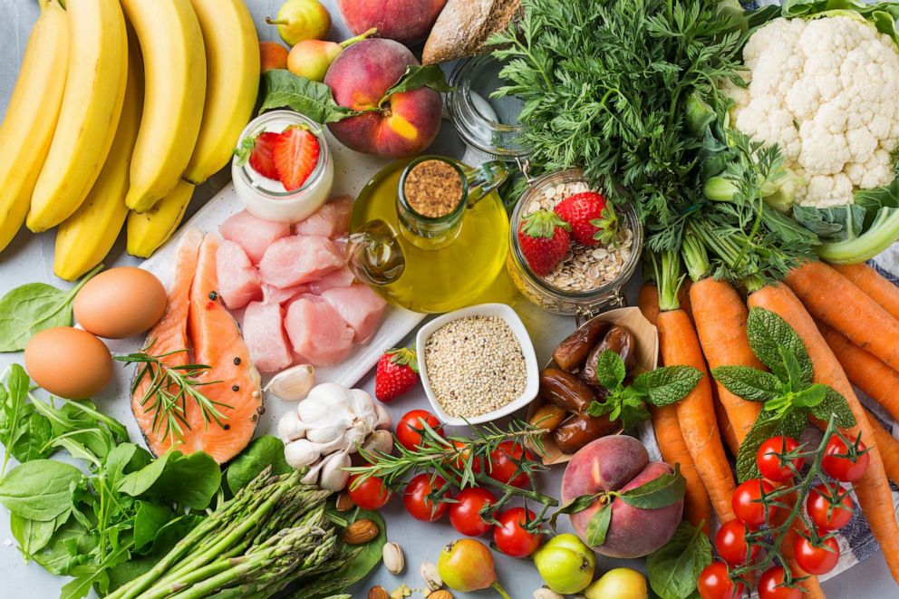 PHOTO: Assortment of healthy food ingredients for cooking on a kitchen table.