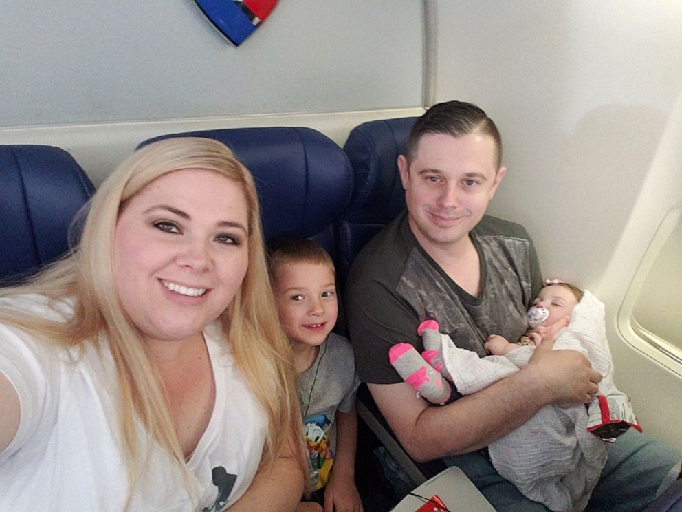 PHOTO: Ashley Dowell is pictured here with her husband, Will, and their children during their baby daughter's first flight.