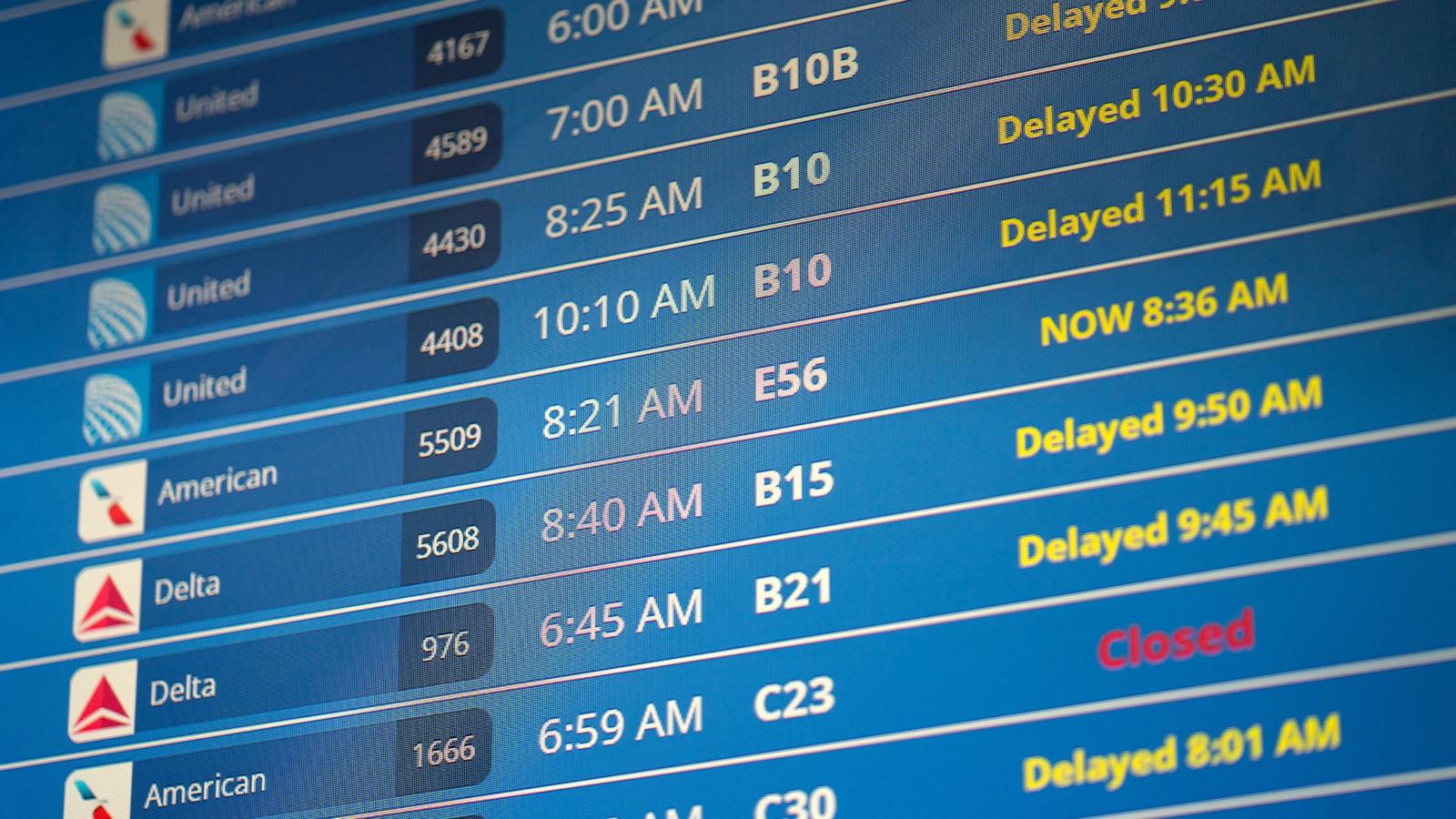 PHOTO: In this July 19, 2024, file photo, flight information is seen on a display screen at Ronald Regan Washington National Airport in Washington, D.C.