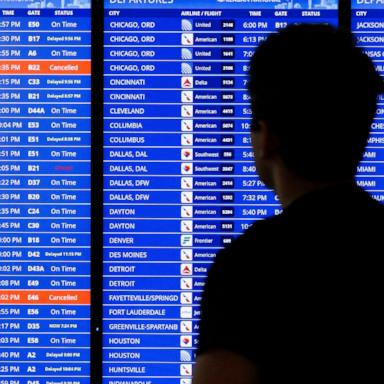 PHOTO: A flight departure information board is seen, July 23, 2024 at Ronald Reagan Airport in Arlington, Virginia.