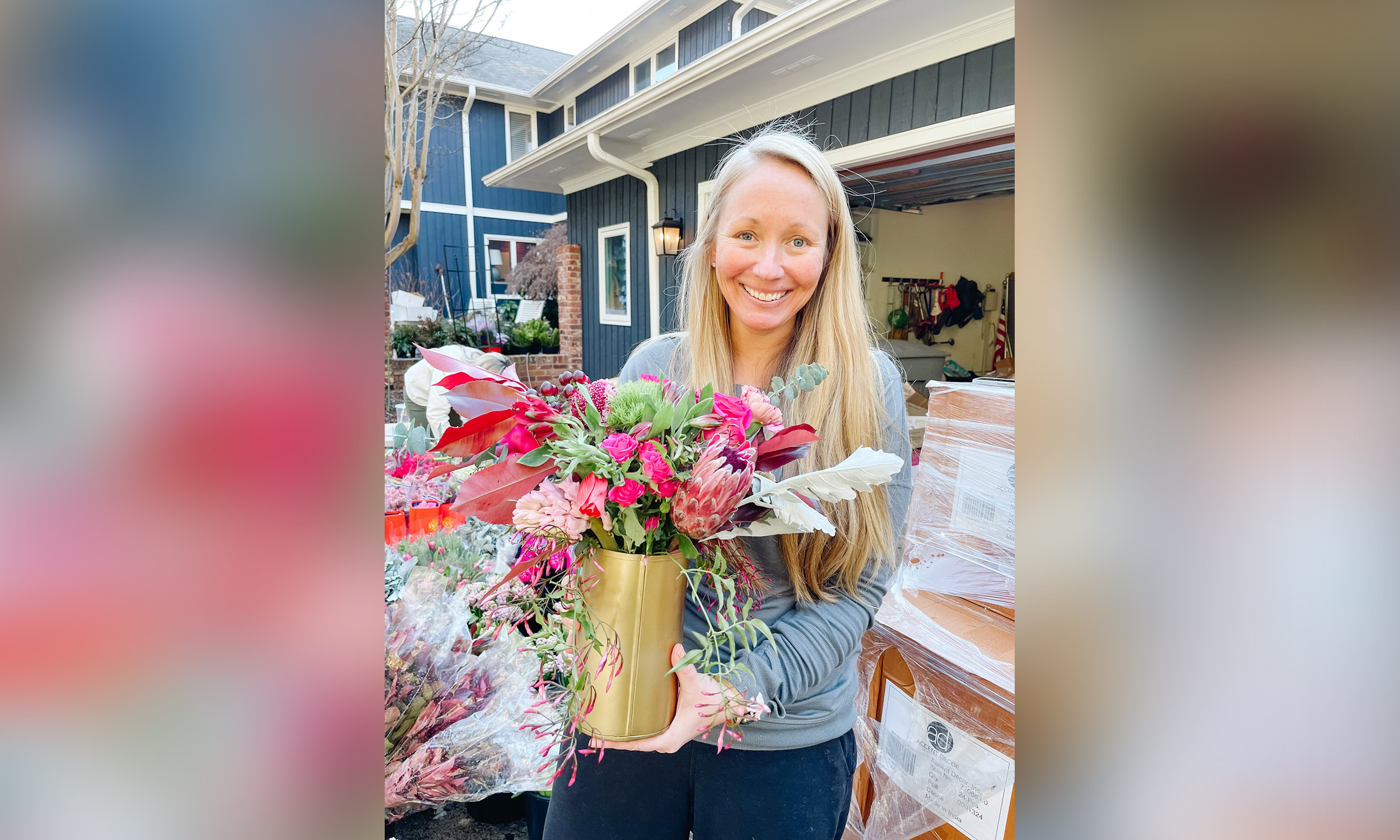 PHOTO:  Ashley Manning holds a flower arrangement that will be donated to a widow in Charlotte, North Carolina, on Feb. 14, 2022.