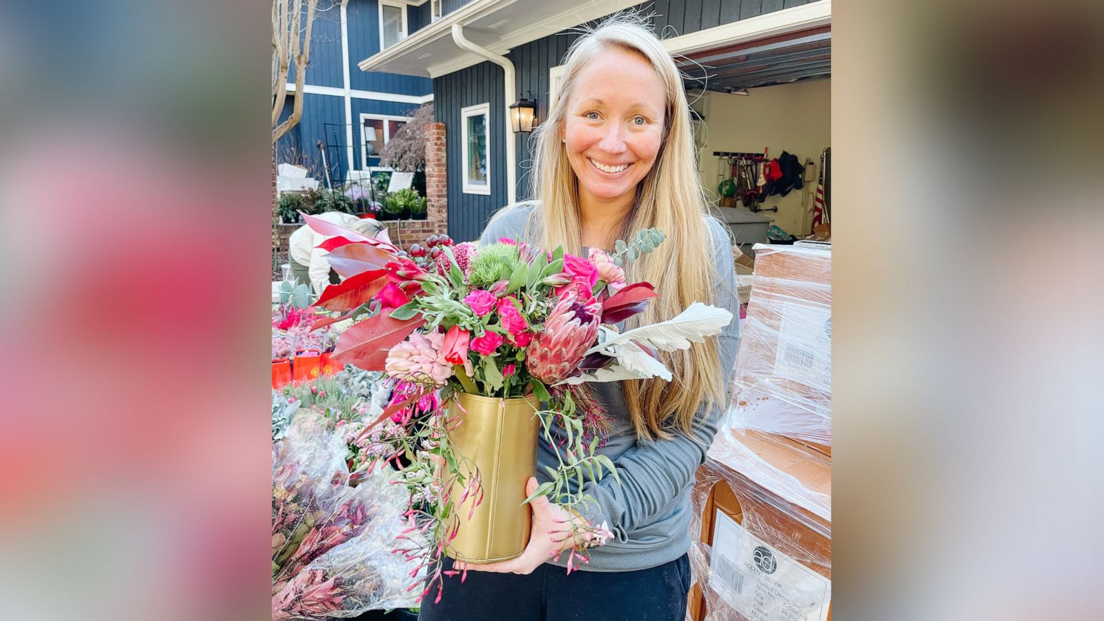 PHOTO: Ashley Manning holds a flower arrangement that will be donated to a widow in Charlotte, North Carolina, on Feb. 14, 2022.