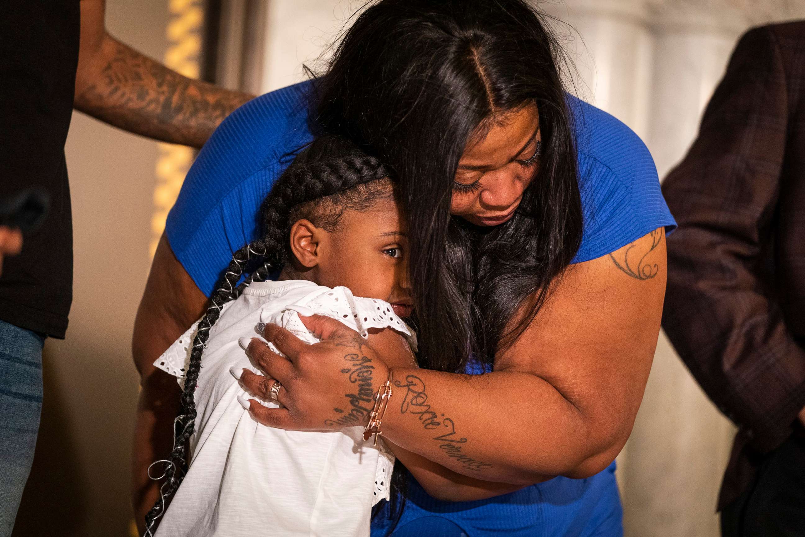 PHOTO: George Floyd's daughter Gianna Floyd, 6, gives her mother Roxie Washington a hug during a press conference, June 2, 2020, at Minneapolis City Hall. 