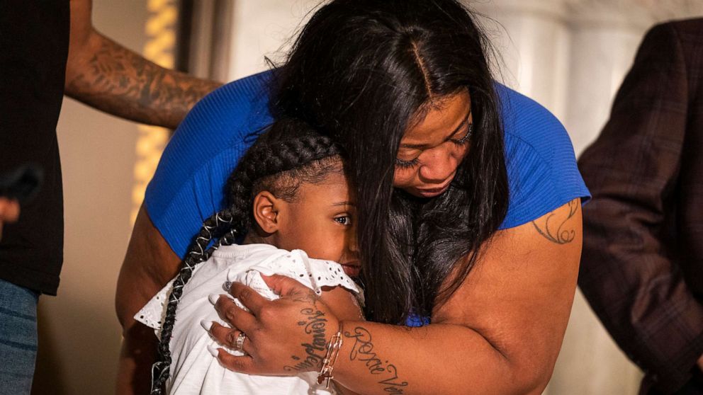 PHOTO: George Floyd's daughter Gianna Floyd, 6, gives her mother Roxie Washington a hug during a press conference, June 2, 2020, at Minneapolis City Hall. 