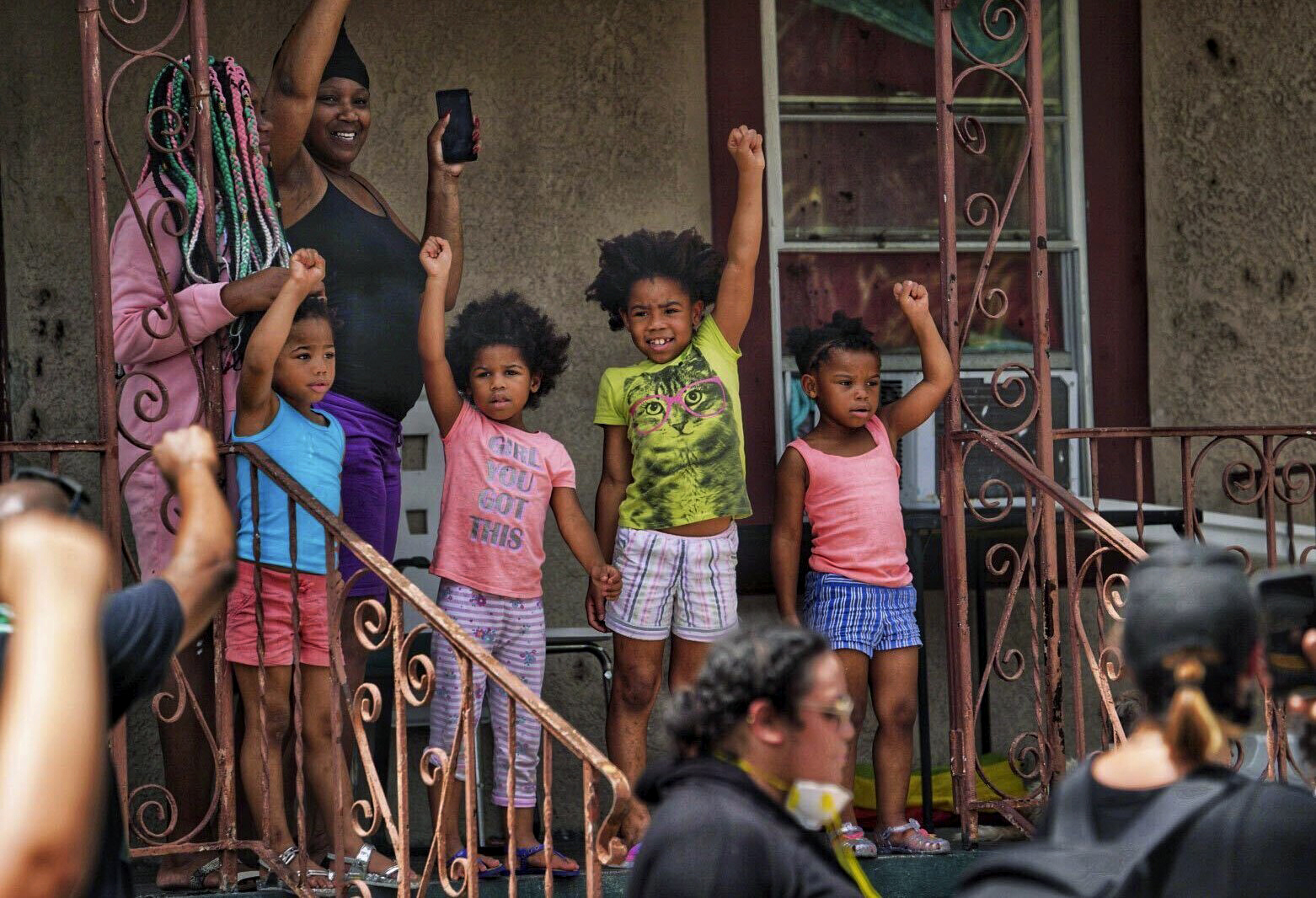 PHOTO: People shows their support for a Black Lives Matter march as it passes, May 31, 2020, in Tampa, Fla.