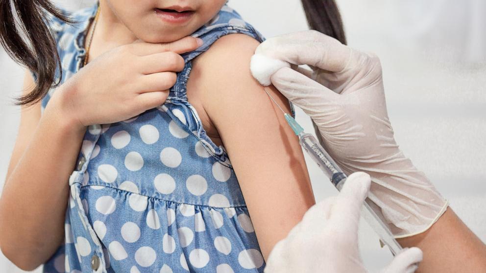 PHOTO: A child is given a flu shot.