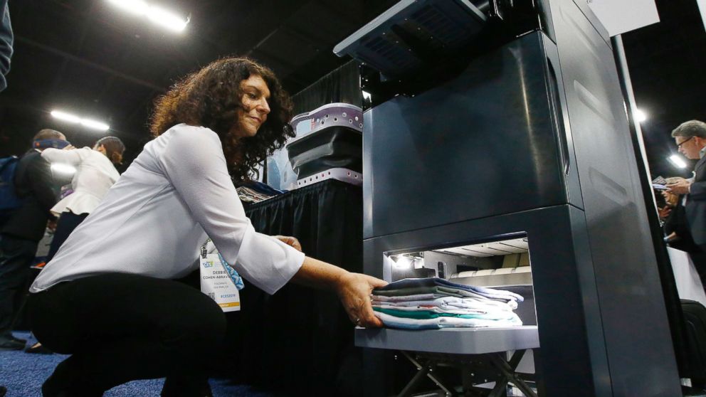 PHOTO: Debbie Cohen-Abravanel, CMO at Foldimate, demonstrates the new device that folds your clothes automatically, during the preview at CES 2019, Jan. 6, 2019, in Las Vegas, Nevada.