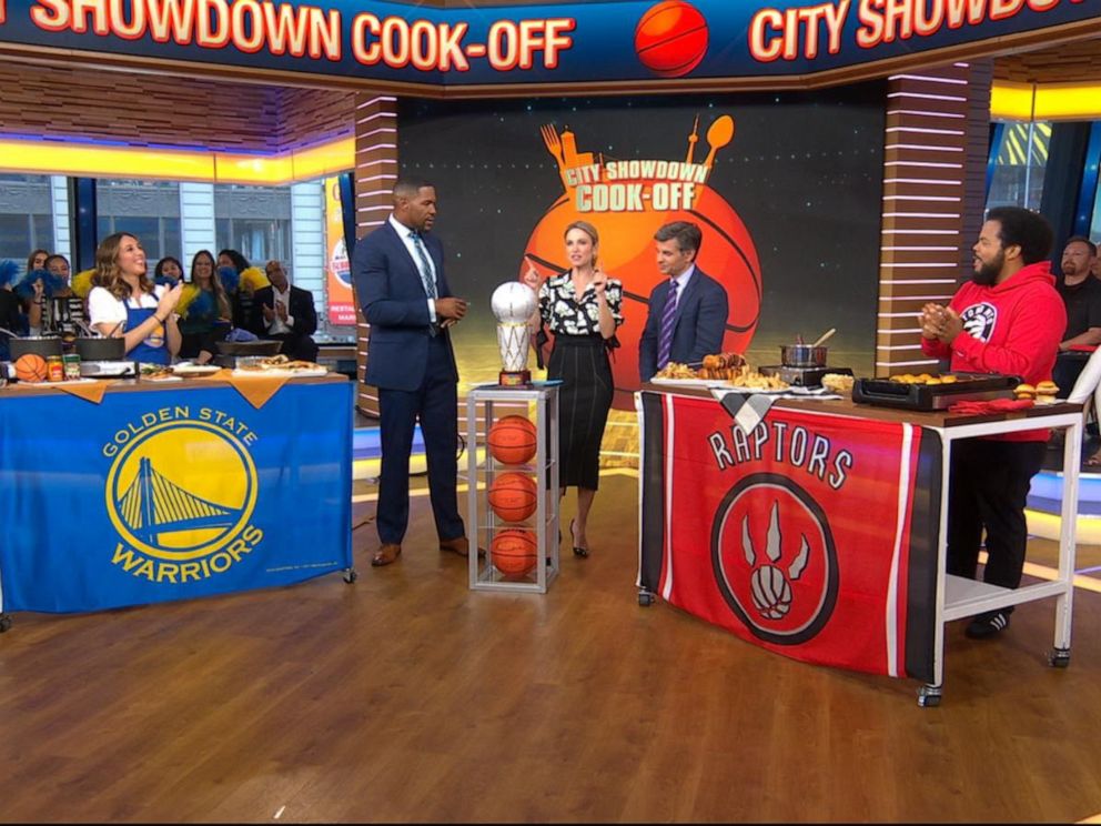 PHOTO: Toronto Raptors fan Roger Mooking, right, and Golden State Warriors fan Leah Cohen share recipes for the NBA Finals.