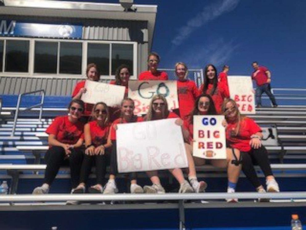 PHOTO: Families cheer on the Hughes High School football team at a game in Cincinnati, Ohio.