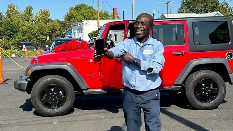 PHOTO: Francis Apraku, a custodian at James Madison High School in Vienna, Virginia, was surprised with a red Jeep Wrangler by Madison High School students who teamed up to fundraise the money for Apraku’s new car.