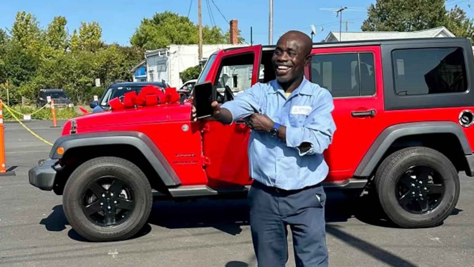 PHOTO: Francis Apraku, a custodian at James Madison High School in Vienna, Virginia, was surprised with a red Jeep Wrangler by Madison High School students who teamed up to fundraise the money for Apraku’s new car.