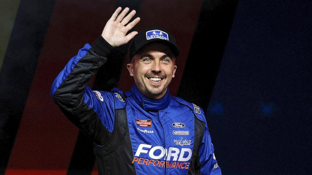 PHOTO: Frankie Muniz waves to fans as he walks onstage during driver intros prior to the NASCAR Craftsman Truck Series Kubota Tractor 200 at Kansas Speedway, Sept. 27, 2024, in Kansas City, Kan.