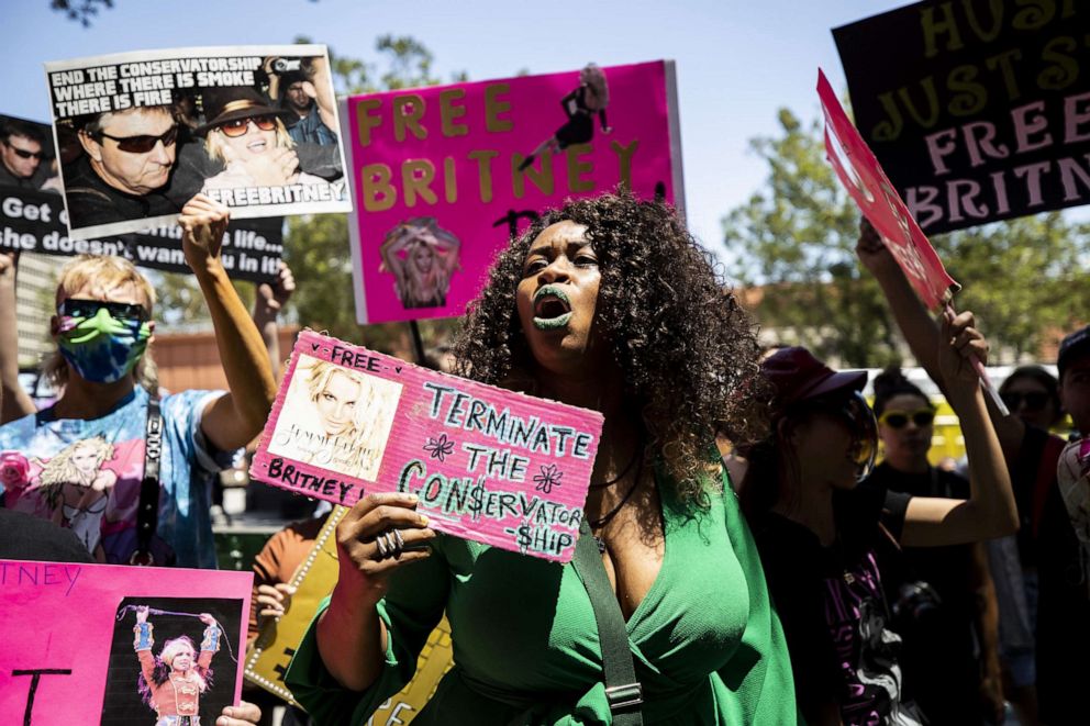 PHOTO:A protester holds a sign reading 'Terminate the conservatorship' as hundreds of people participate in a #FREEBRITNEY rally in front of the court house where Britney Spears appeared remotely in a conservatorship hearing in Los Angeles, June 23, 2021.