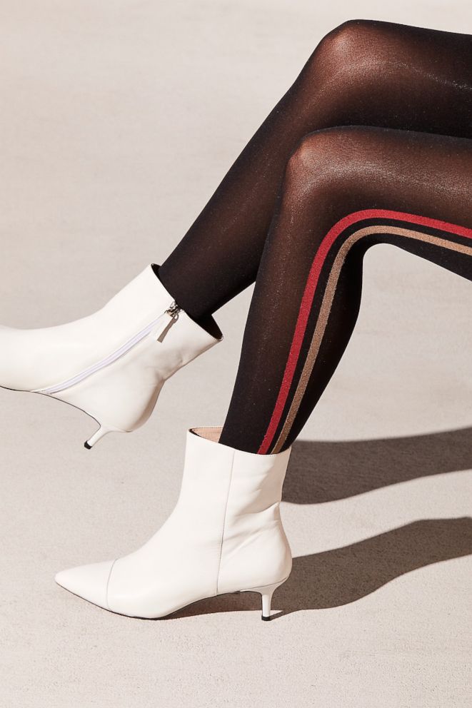 PHOTO: As temps drop, opaque tights are coming back in a big way. We love the surprise flash of racing stripes. Style Hint: Wear them on your busiest days with a mini corduroy or denim skirt to feel like you're winning.