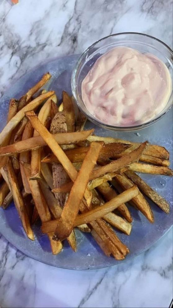 PHOTO: A plate of french fries with 18,000 island dressing.