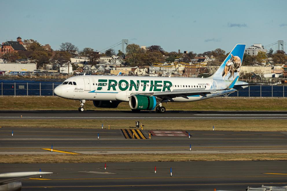 PHOTO: Frontier Airlines Airbus A320neo passenger aircraft spotted on final approach flying, landing and taxiing on the runway and taxiway of LaGuardia airport in New York, Nov, 12, 2024.