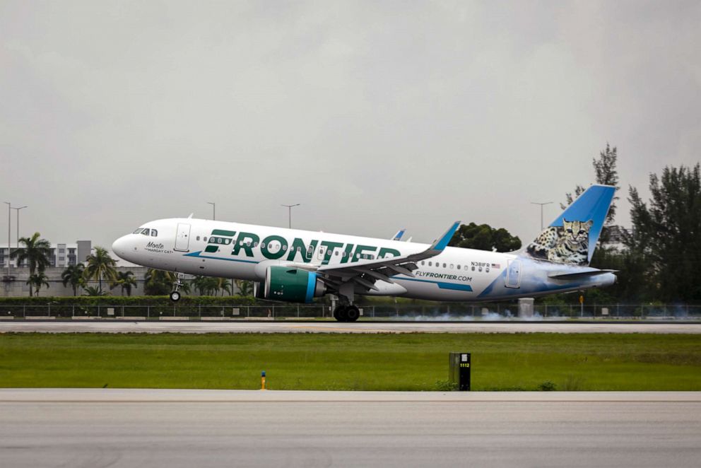 PHOTO: In this June 16, 2021, file photo, a passenger aircraft operated by Frontier Airlines Inc. lands at Miami International Airport in Miami.