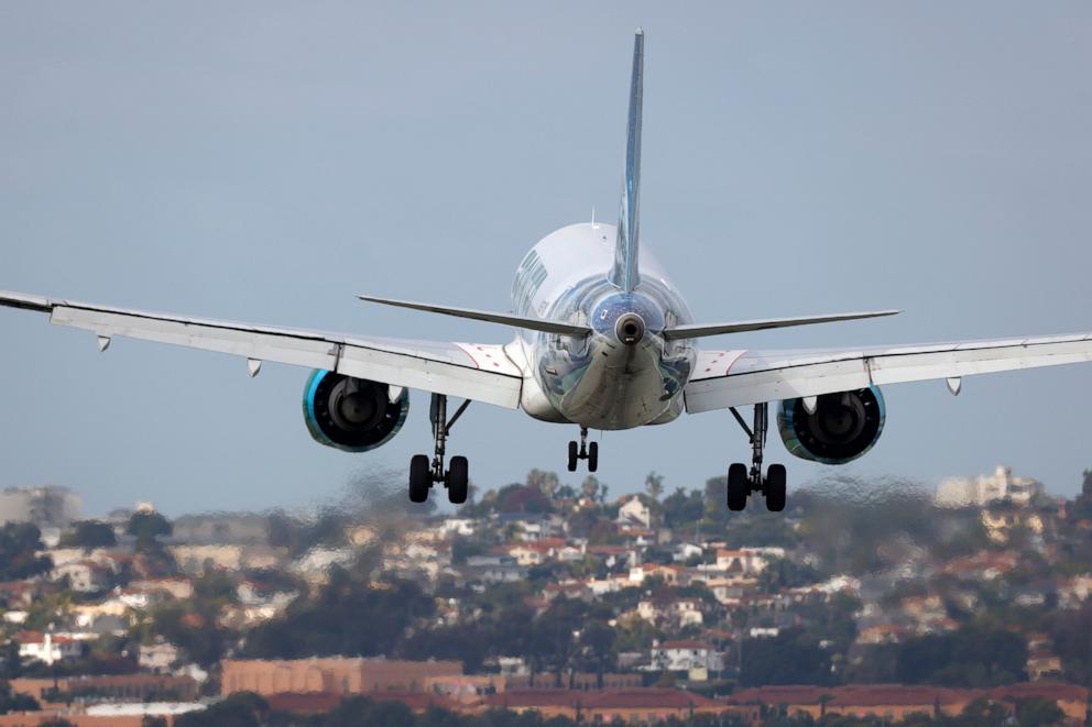 PHOTO: A Frontier Airlines Airbus A320-251N aircraft approaches San Diego International Airport for a landing from Phoenix on November 18, 2024 in San Diego, California.