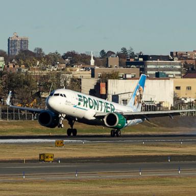 PHOTO: Frontier Airlines Airbus A320neo passenger aircraft spotted on final approach flying, landing and taxiing on the runway and taxiway of LaGuardia airport in NYC.