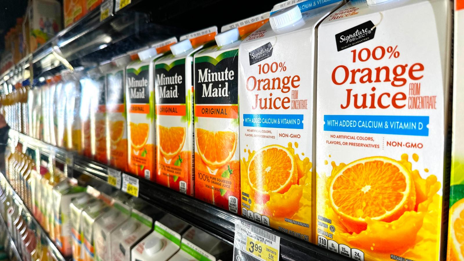 PHOTO: Cartons of Florida's Natural orange juice are displayed for sale and reflected in a case in a grocery store on September 28, 2023 in Los Angeles, California.