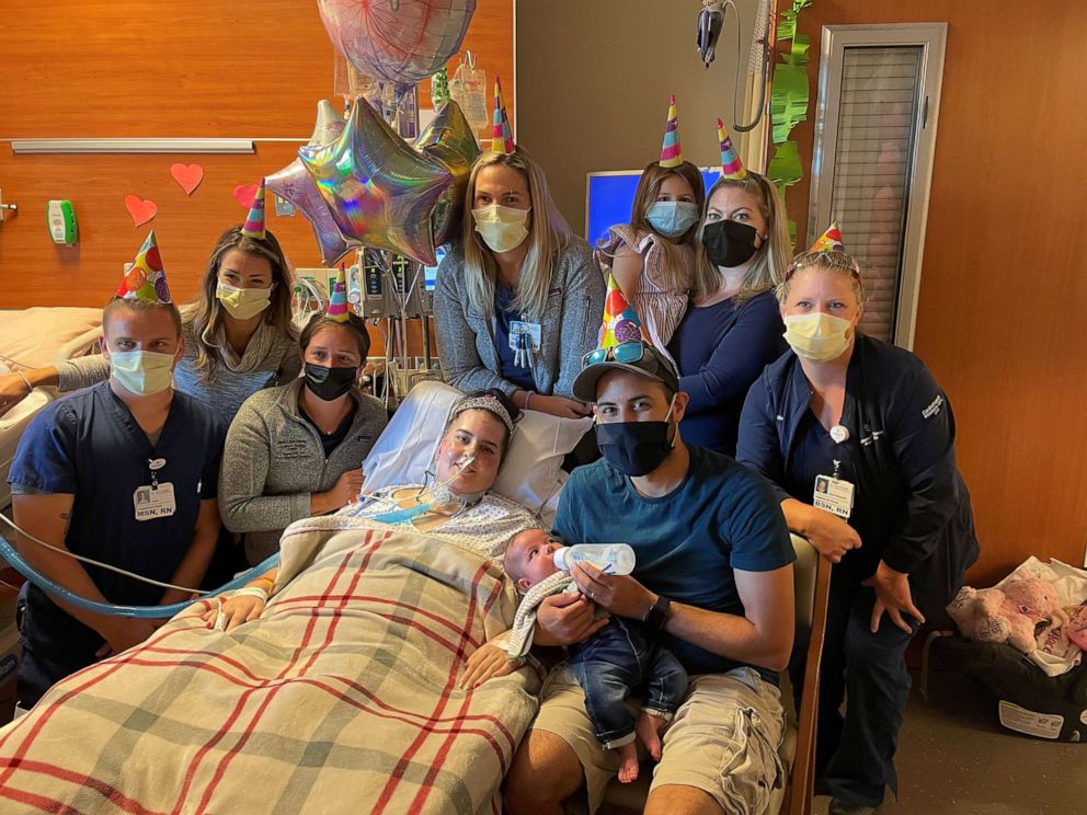 PHOTO: Marissa Fuentes poses for a photo with family and her medical care team on her 29th birthday.