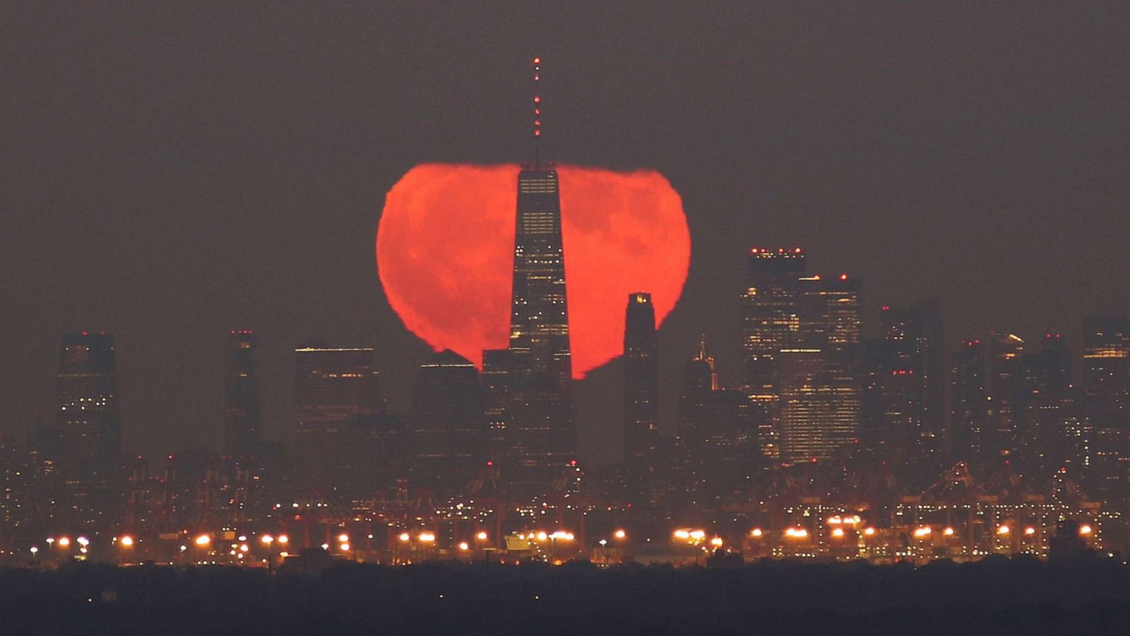 PHOTO: FILE - The full Blue Moon and Hunter's Moon rises behind lower Manhattan and One World Trade Center in New York City on Halloween. Oct. 31, 2020 as seen from Greenbrook Township, New Jersey.