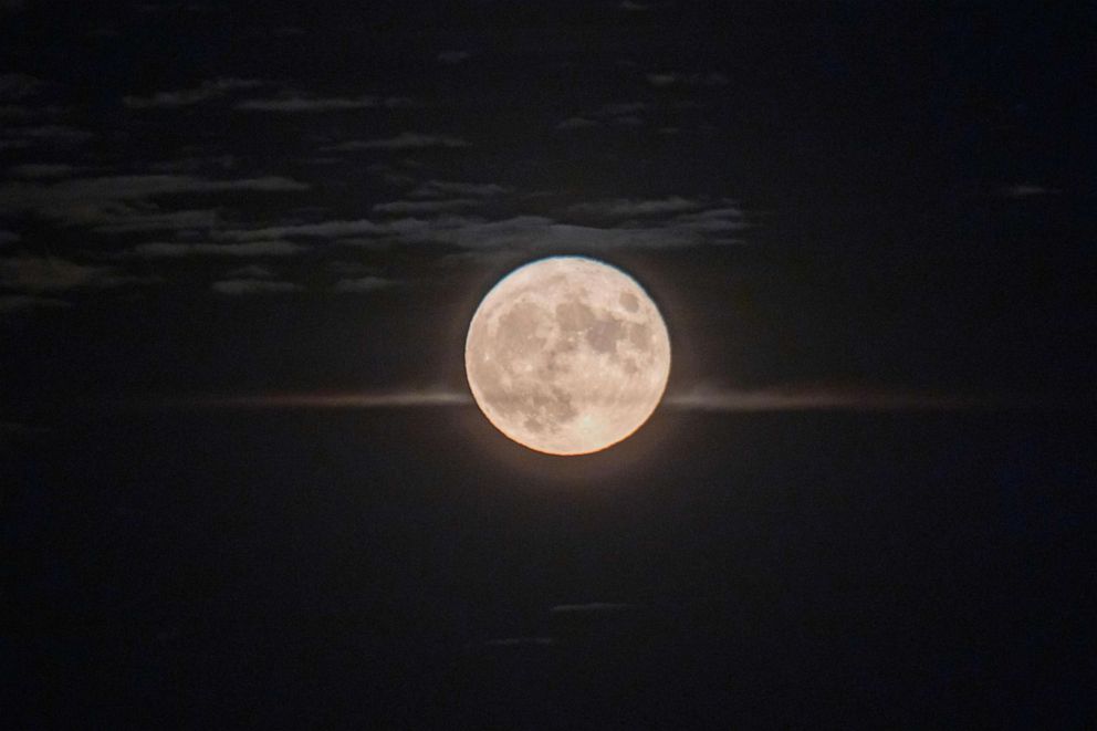 PHOTO: The Full Corn Moon shines behind Hortiatis mountain over the city of Thessaloniki, Greece, Sept. 2, 2020.