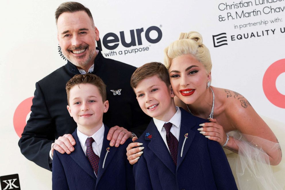 PHOTO: David Furnish, Lady Gaga, Zachary Jackson Levon Furnish-John and Elijah Joseph Daniel Furnish-John attend the Elton John Aids Foundation Academy Awards viewing party at West Hollywood Park in West Hollywood, Calif. on March 27, 2022.