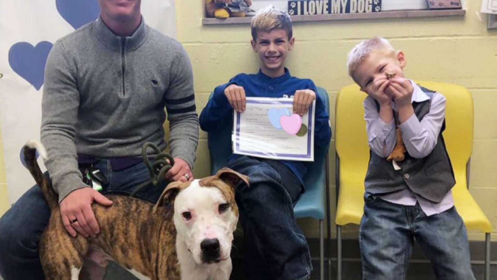 PHOTO: Gabe Banzhof, 10, is seen with his adopted father, Thomas Banzhof and brother, Eli Banzhof, 5 on April 17, 2019 at Lucas County Canine Care & Control in Toledo, Ohio, on the day he brought home his dog, Cupid.