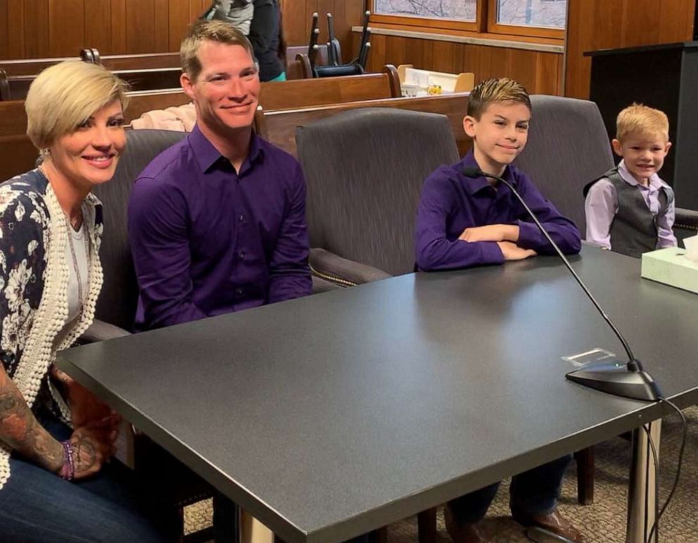 PHOTO: Gabe Banzhof, 10, is seen at a Monroe Country courthouse in Michigan, with his mother, Jessica Banzhof, 10, brother Eli Banzhof, 5 and father Thomas Banzhof, on April 17, 2019, on the day Gabe was adopted by his dad.