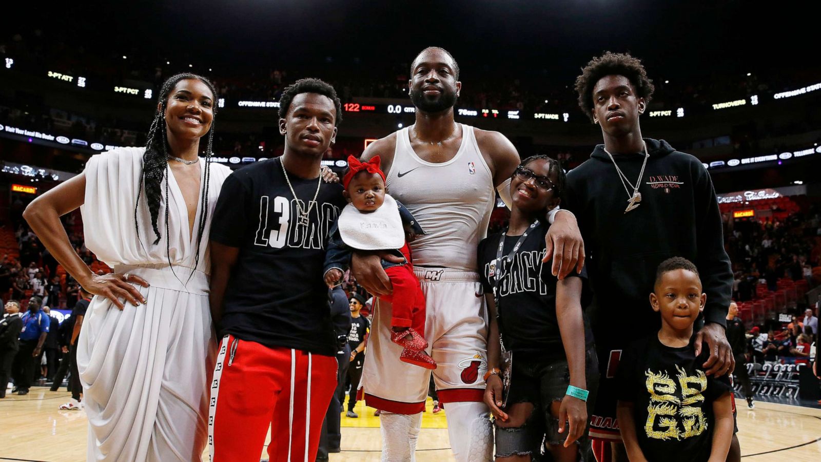 PHOTO: Dwyane Wade poses for a photo with his wife, Gabrielle Union, nephew, Dahveon Morris, and children, Kaavia James Union Wade, Zaire Wade, Xavier Wade and Zion Wade after his final career home game on April 09, 2019, in Miami.