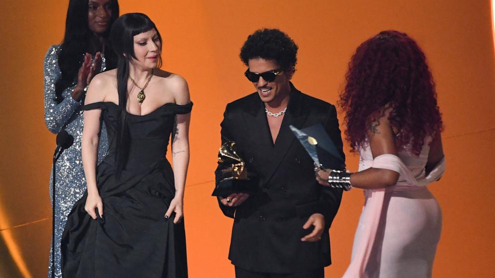 PHOTO: Lady Gaga and Bruno Mars accept the Best Pop Duo/Group Performance award for "Die With a Smile" on stage during the 67th Annual Grammy Awards in Los Angeles on Feb. 2, 2025. 