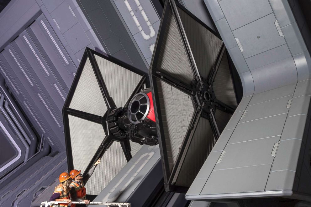 PHOTO: Disney Imagineers view a life-size TIE fighter as they work on Star Wars: Rise of the Resistance at Star Wars: Galaxy's Edge.