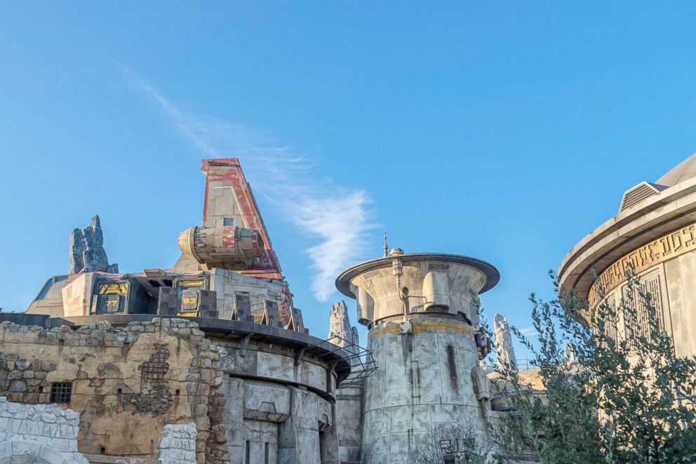 PHOTO: Paint detailing appears mostly complete in this section of Star Wars: Galaxy's Edge, where a transport shuttle is docked on top of a large hangar.