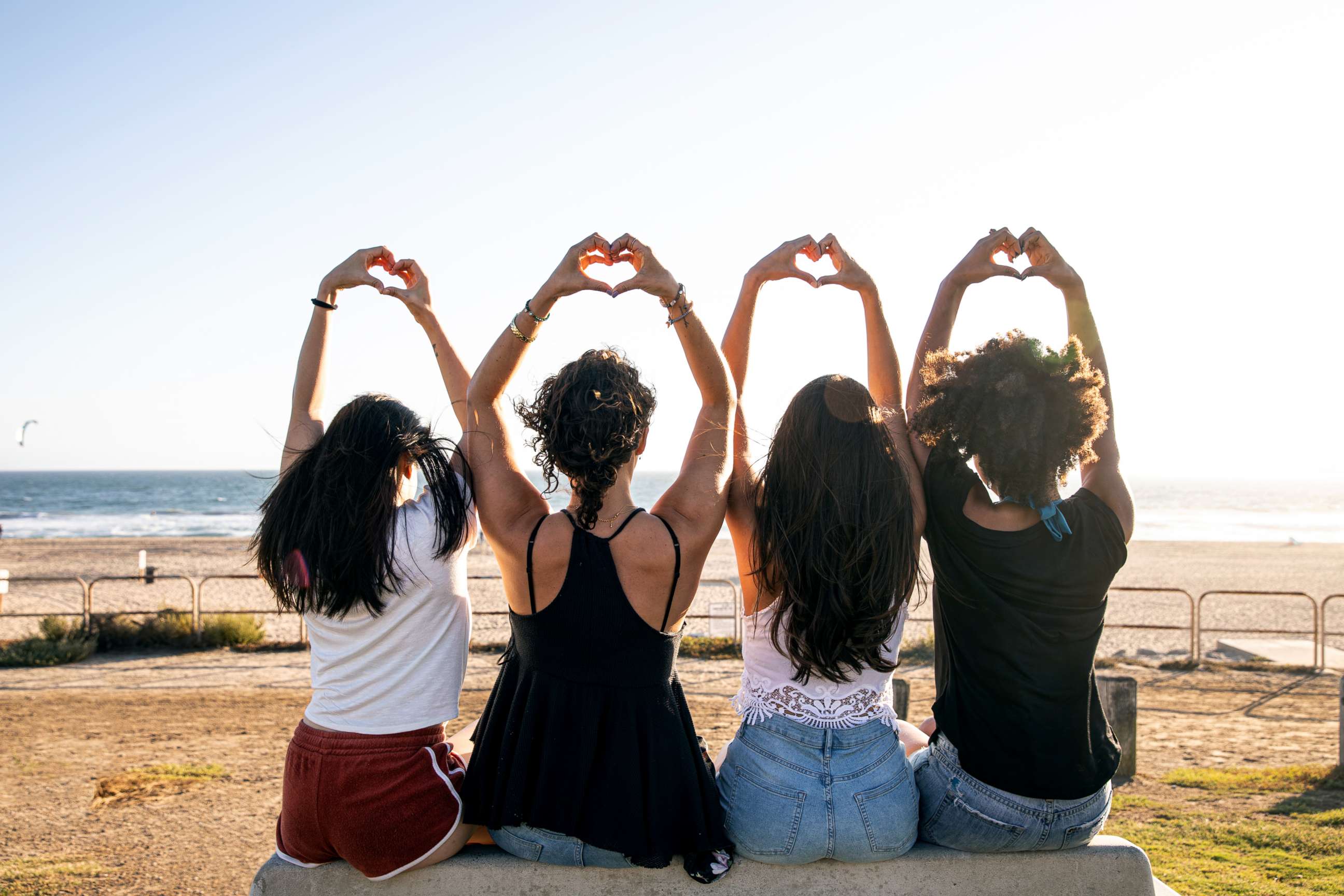 PHOTO: A group of women make heart hands in this stock photo.