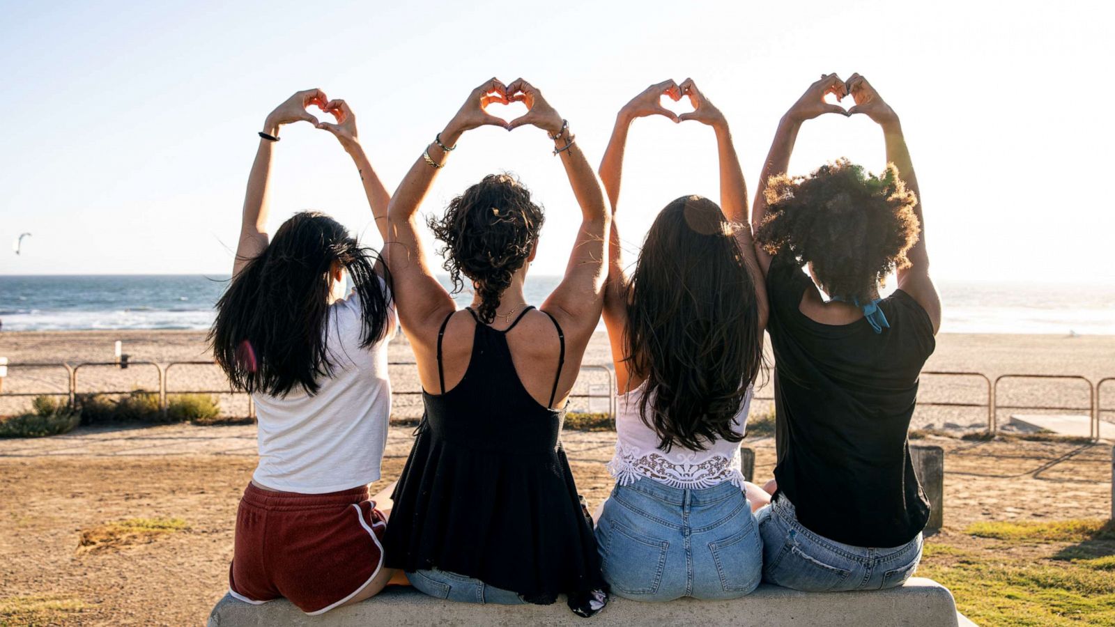 PHOTO: A group of women make heart hands in this stock photo.