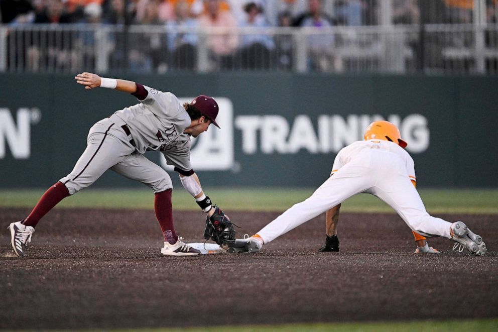 PHOTO: FILE - Hunter Haas #2 of the Texas A&M Aggies tags Christian Moore #1 of the Tennessee Volunteers out at second base in the fourth inning at Lindsey Nelson Stadium, March 24, 2023 in Knoxville, Tenn.