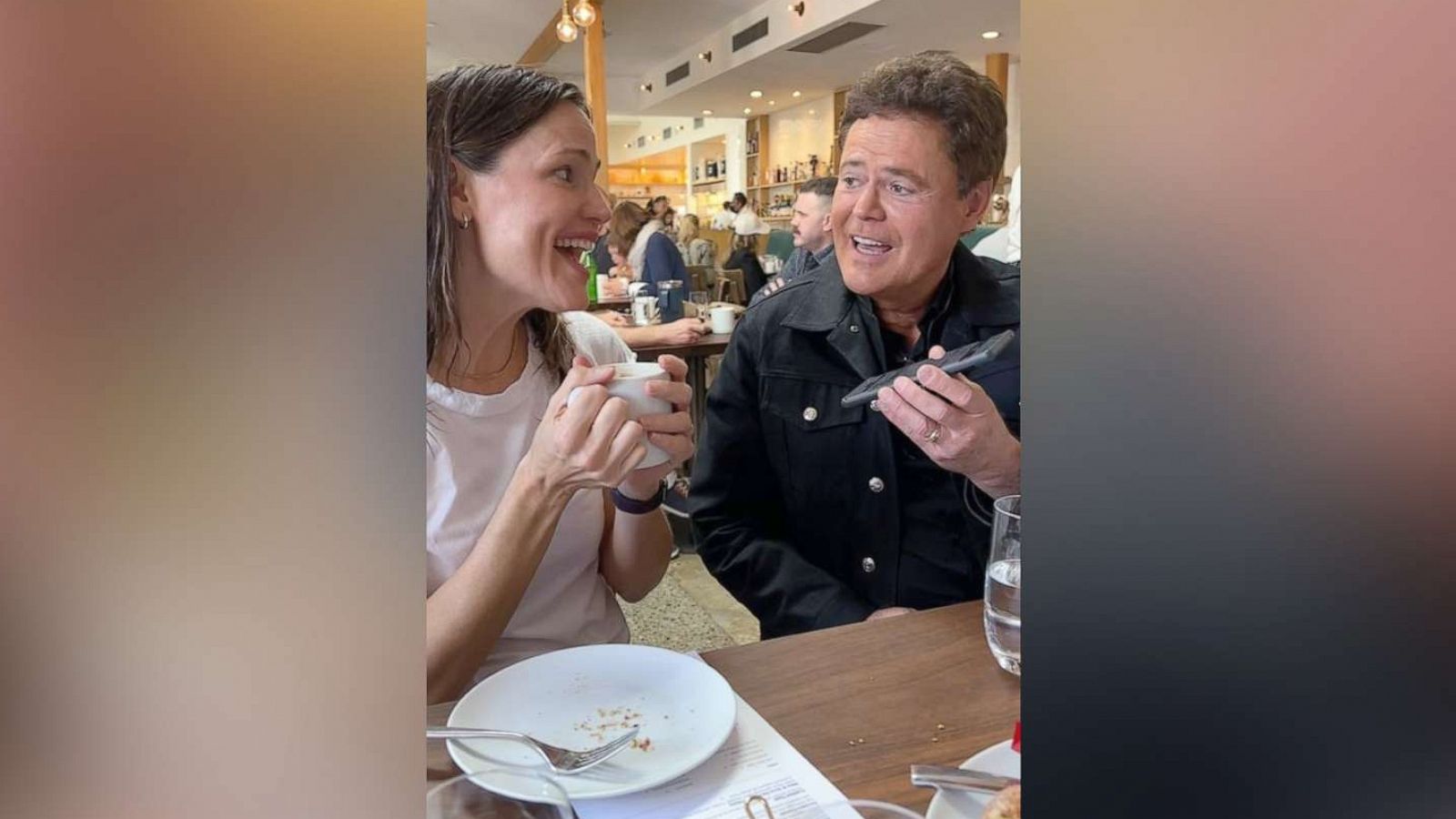 PHOTO: Jennifer Garner sings with Donny Osmond in a video posted to her social media account after he surprised her for her 50th birthday, April 16, 2022.