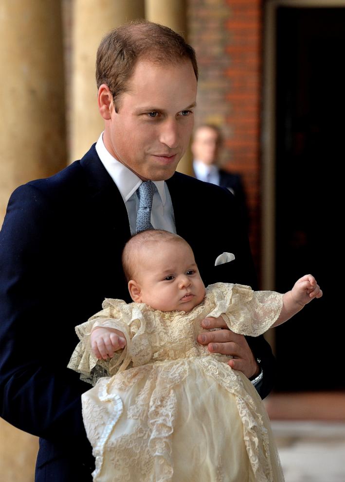 PHOTO: Prince William, Duke of Cambridge arrives, holding his son Prince George, at Chapel Royal in St James's Palace, ahead of the christening of the three month-old Prince George of Cambridge by the Archbishop of Canterbury, Oct. 23, 2013, in London.