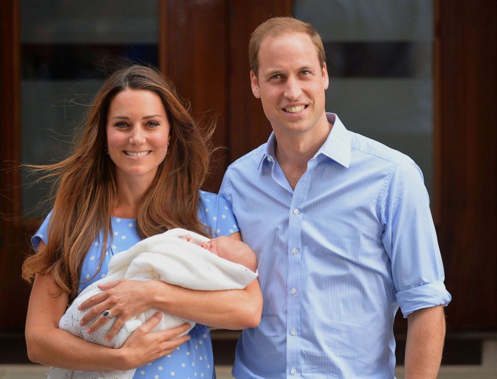 PHOTO: Prince William and Catherine, Duchess of Cambridge show their new-born baby boy to the world's media, standing on the steps outside the Lindo Wing of St Mary's Hospital in London on July 23, 2013.